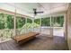Screened-in porch with a wooden porch swing, perfect for relaxing outdoors at 3774 Seasons Nw Dr, Acworth, GA 30101