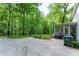 Backyard featuring a lawn, patio, and screened porch, perfect for outdoor enjoyment at 4219 Harrogate Nw Dr, Atlanta, GA 30327