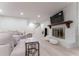 Finished basement with a modern fireplace and comfortable seating area at 4219 Harrogate Nw Dr, Atlanta, GA 30327