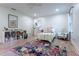 Airy bedroom with hardwood floors, decorative rug, with natural light at 4219 Harrogate Nw Dr, Atlanta, GA 30327