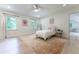Light-filled bedroom showcasing hardwood floors and two windows for natural light at 4219 Harrogate Nw Dr, Atlanta, GA 30327