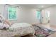 Bright bedroom with hardwood floors, large windows, and a vibrant area rug at 4219 Harrogate Nw Dr, Atlanta, GA 30327