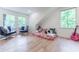 Sunlit bedroom with hardwood floors and a cozy nook, ideal for relaxation at 4219 Harrogate Nw Dr, Atlanta, GA 30327