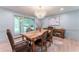Light-filled dining room featuring modern decor, stylish lighting and soft color palette at 4219 Harrogate Nw Dr, Atlanta, GA 30327