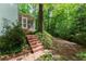 Charming front porch with sitting area and a brick walkway at 4219 Harrogate Nw Dr, Atlanta, GA 30327