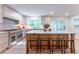 Bright kitchen features a marble island, stainless steel appliances, and ample natural light at 4219 Harrogate Nw Dr, Atlanta, GA 30327