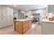 Open kitchen with a marble island, stainless steel appliances, and hardwood floors at 4219 Harrogate Nw Dr, Atlanta, GA 30327