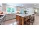 Modern kitchen with marble countertops, an island with seating, and stainless steel appliances at 4219 Harrogate Nw Dr, Atlanta, GA 30327
