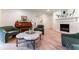Stylish living room with a grand piano, comfortable seating, and a cozy fireplace at 4219 Harrogate Nw Dr, Atlanta, GA 30327