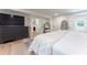 Spacious bedroom with a large dresser, hardwood floors, and ample natural light at 4219 Harrogate Nw Dr, Atlanta, GA 30327