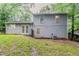 Exterior view of home's backyard with lush greenery, offering private outdoor space at 4905 Sandberg Ct, Stone Mountain, GA 30088