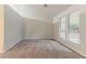 Bright bedroom featuring carpet floors, neutral paint, and natural light from large windows at 4905 Sandberg Ct, Stone Mountain, GA 30088