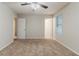 Neutral bedroom with carpet and a window allowing natural light to illuminate the room, and ceiling fan at 4905 Sandberg Ct, Stone Mountain, GA 30088