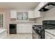Bright kitchen featuring plenty of counter space, a gas range, and stainless steel sink at 4905 Sandberg Ct, Stone Mountain, GA 30088