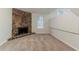 Spacious living room with a stone fireplace and neutral carpet, providing a cozy atmosphere at 4905 Sandberg Ct, Stone Mountain, GA 30088