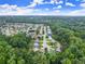 Expansive residential area, bordered by lush trees and green spaces offering a serene lifestyle at 6160 Overleaf Ter, Cumming, GA 30040