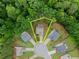 Aerial view showcases property lines of home nestled amongst lush greenery at 6160 Overleaf Ter, Cumming, GA 30040