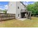 Fenced backyard with a wooden deck and stairs leading to a patio; a perfect outdoor space at 6160 Overleaf Ter, Cumming, GA 30040
