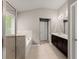 Bright bathroom with a glass shower, soaking tub, and double vanity at 6160 Overleaf Ter, Cumming, GA 30040