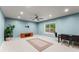 Spacious bonus room with carpet, a ceiling fan, and natural light from a window at 6160 Overleaf Ter, Cumming, GA 30040