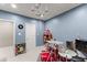 This is a bonus room with a drum set, light blue walls, and carpet flooring at 6160 Overleaf Ter, Cumming, GA 30040