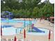 Community pool featuring a water slide, lounge chairs, and ample space for relaxation at 6160 Overleaf Ter, Cumming, GA 30040