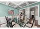 Formal dining room with coffered ceilings and views of the entryway at 6160 Overleaf Ter, Cumming, GA 30040
