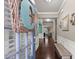 Inviting foyer features hardwood floors, wainscoting, and a cozy bench at 6160 Overleaf Ter, Cumming, GA 30040