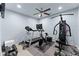 Home gym featuring a variety of exercise equipment, including a treadmill and weights at 6160 Overleaf Ter, Cumming, GA 30040
