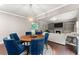 Bright dining area flows into the comfortable living room with a fireplace at 6160 Overleaf Ter, Cumming, GA 30040