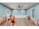 Bright playroom features hardwood floors, recessed lighting, and plenty of natural light at 6160 Overleaf Ter, Cumming, GA 30040