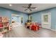 Bright playroom with hardwood floors, play kitchen, and access to backyard at 6160 Overleaf Ter, Cumming, GA 30040