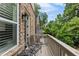 Private balcony with seating area overlooking lush greenery at 148 Canton St, Alpharetta, GA 30009