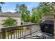 Relaxing balcony view with a grill overlooking landscaped greenery and a quiet residential street at 148 Canton St, Alpharetta, GA 30009