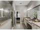 Elegant bathroom showcasing double vanity with granite counters and frameless glass shower at 148 Canton St, Alpharetta, GA 30009