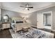 Bedroom featuring a ceiling fan, area rug, neutral walls, natural light and white trim at 148 Canton St, Alpharetta, GA 30009