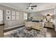 Bedroom featuring a ceiling fan, area rug, neutral walls, natural light and white trim at 148 Canton St, Alpharetta, GA 30009