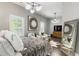 Bright bedroom with modern lighting, seating area, large mirror, and accent art at 148 Canton St, Alpharetta, GA 30009