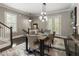 Elegant dining room with modern light fixture, stylish rug, and seating for six at 148 Canton St, Alpharetta, GA 30009