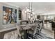 Elegant dining room with modern chandelier, stylish furniture, hardwood floors, and access to a gourmet kitchen at 148 Canton St, Alpharetta, GA 30009