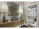 Stylish entryway featuring a console table with lamps, decor, and a view into the main bedroom at 148 Canton St, Alpharetta, GA 30009