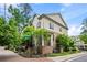 Charming two-story home with brick and siding exterior, lush landscaping, and welcoming front entrance at 148 Canton St, Alpharetta, GA 30009