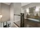 Upstairs hallway featuring hardwood floors and decorative wall art at 148 Canton St, Alpharetta, GA 30009