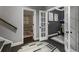 Open hallway featuring hardwood floors and doorways to multiple rooms, enhancing flow and connectivity at 148 Canton St, Alpharetta, GA 30009