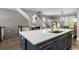 Open kitchen with a large island, stainless steel appliances, and hardwood floors at 148 Canton St, Alpharetta, GA 30009
