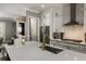 Modern kitchen with white cabinets, stainless steel appliances, and granite countertops at 148 Canton St, Alpharetta, GA 30009