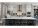 Modern kitchen featuring white cabinets, stainless steel appliances, and a large center island at 148 Canton St, Alpharetta, GA 30009