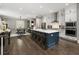 Spacious kitchen with island seating and stainless appliances, open to the dining area at 148 Canton St, Alpharetta, GA 30009
