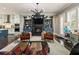 Open-concept living area features fireplace, built-ins, and a modern kitchen at 148 Canton St, Alpharetta, GA 30009