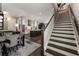 Open-concept living space showcasing a dining area flowing into a modern kitchen with a kitchen island at 148 Canton St, Alpharetta, GA 30009
